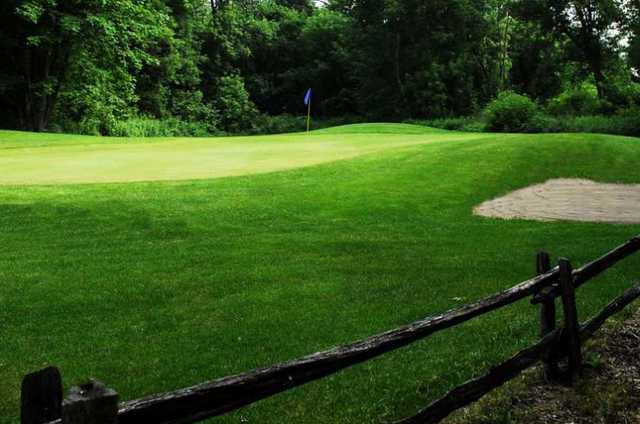 A view over a fence at Fergus Golf Club