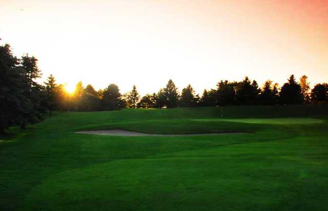 A view of a hole guarded by an undulating bunker at Brookfield Country Club