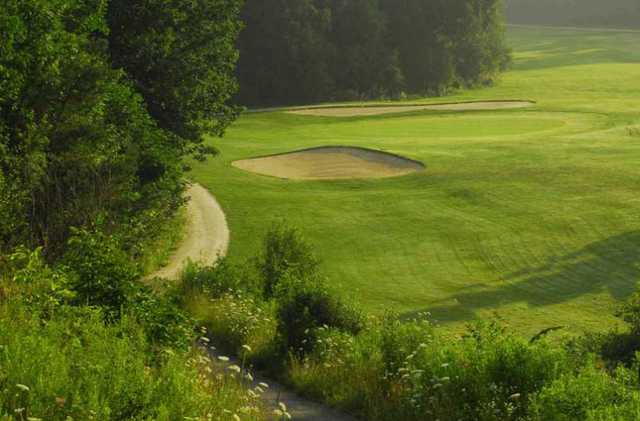A view of a hole flanked by sand traps at Orangeville Golf Club