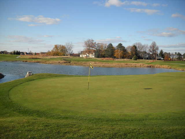 A view of a hole with water in background at Stone Ridge Golf Club