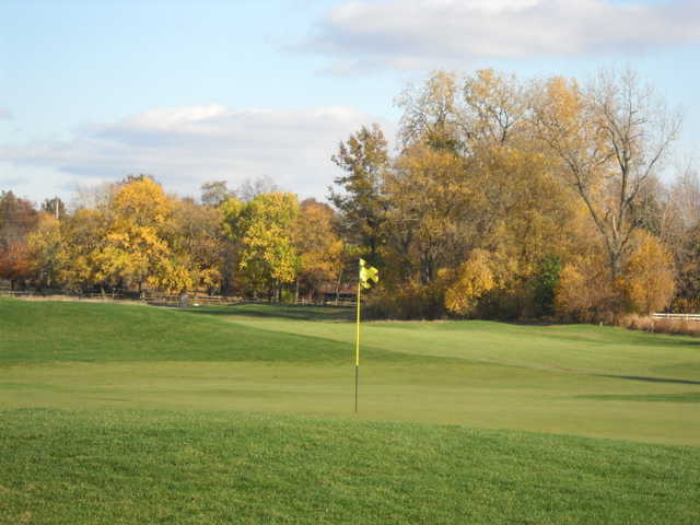 A fall view of a green at Stone Ridge Golf Club