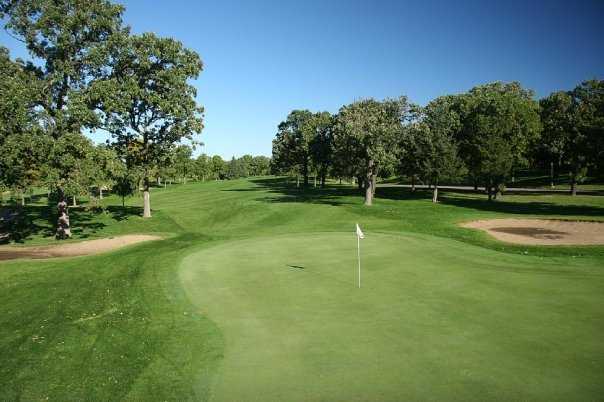 A view of a green protected by sand traps at Phalen Park Golf Course