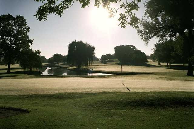 A sunny day view of a hole at Island View Golf Club