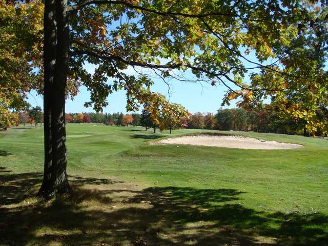 A view of a green protected by a bunker at Wilkes-Barre Golf Club