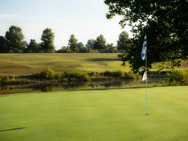 A view of a green with water coming into play at Maysville Country Club