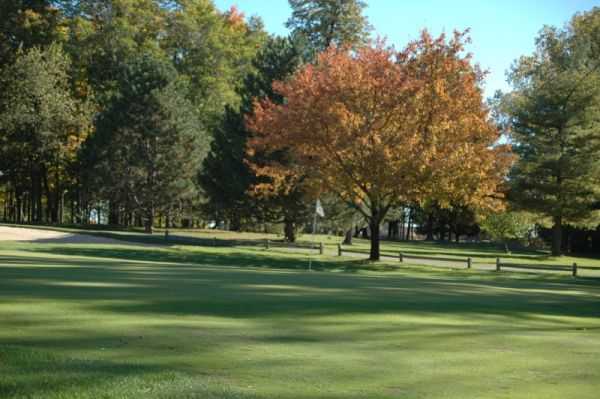 A view of a green protected by a bunker at Whispering Willows