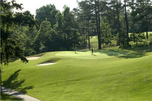 A view of a green protected by sand traps at Highland Walk from Victoria Bryant