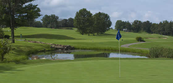 A view of a green with water coming into play at Holiday Hills Resort and Golf Club