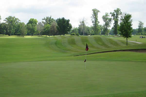A view of a hole and a fairway at Hickory Ridge Golf Center