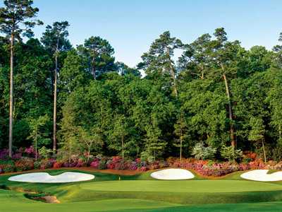 A view of a green protected by bunkers at Willingdon Golf Club