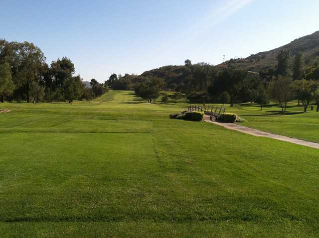 A view from a tee with a bridge on the righ side at Pala Mesa Resort