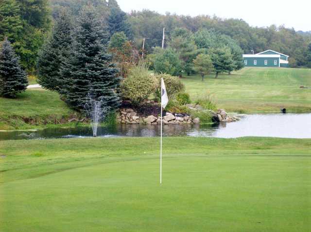 A view of a green surrounded by water at Edgewater Golf Club