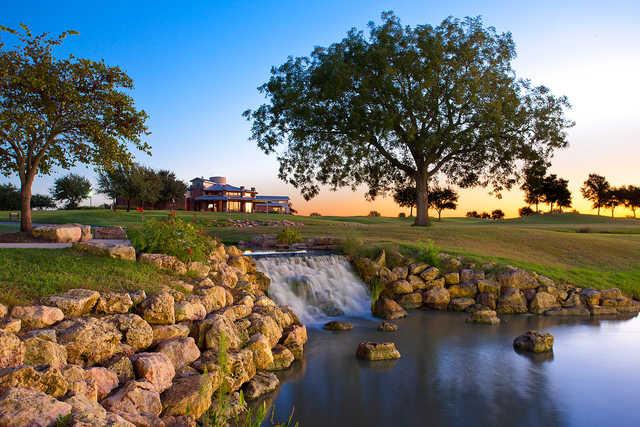 A view of the clubhouse and waterfall at Teravista Golf Club