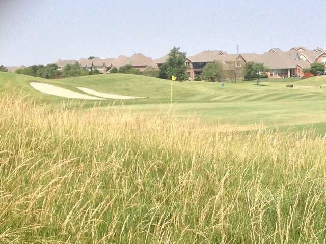 A warm day view of a hole at WestRidge Golf Course