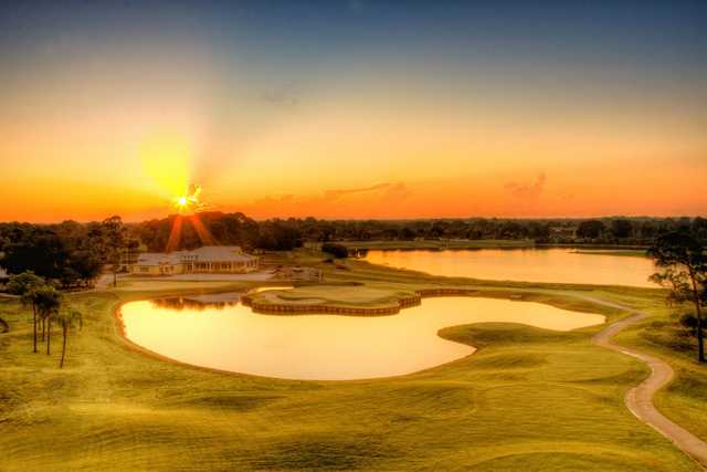 A view of a green surrounded by water at Deer Run from Sun 'n Lake Golf & Country Club