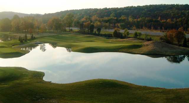 A view of a green with water coming into play at Pine Grove Country Club