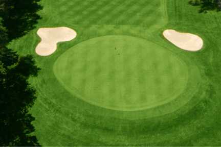 A view of a green protected by bunkers at Allendale Country Club