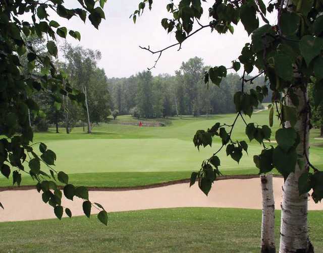 A view of a green protected by sand traps at Ubly Heights Golf Course