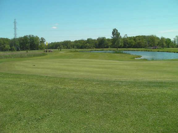 A view of a hole with water in background at Caistorville Golf Club