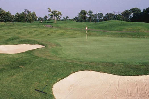 A view of a green protected by sand traps at Turtle Creek Golf Club
