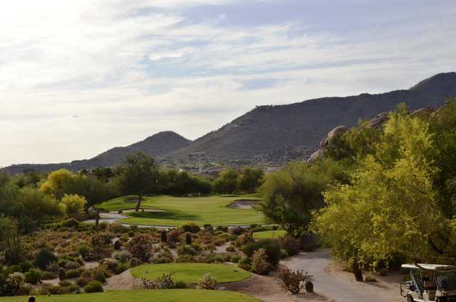 A view of a green flanked by sand traps at Boulders Golf Club & Resort