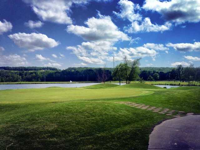 A view of a hole with water in background at Greystone Country Club