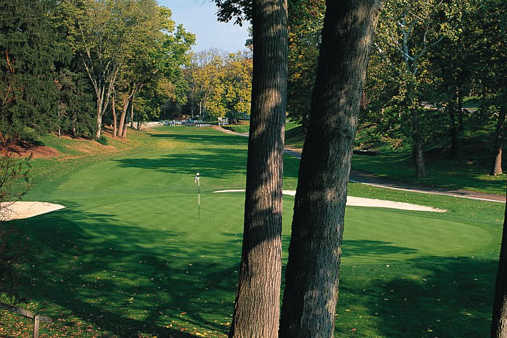 A view of a green protected by sand traps at West from Country Club of Hershey