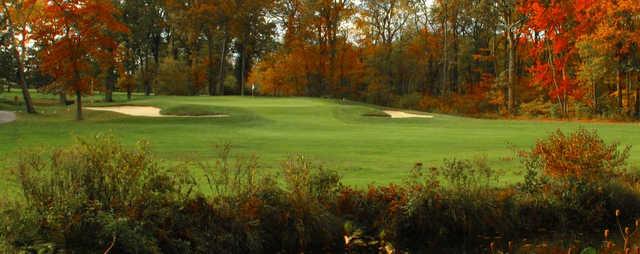 A view of a green flanked by sand traps at Ledgemont Country Club.