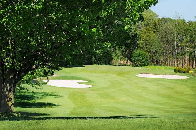 A view of a hole flanked by sand traps at Guelph Country Club