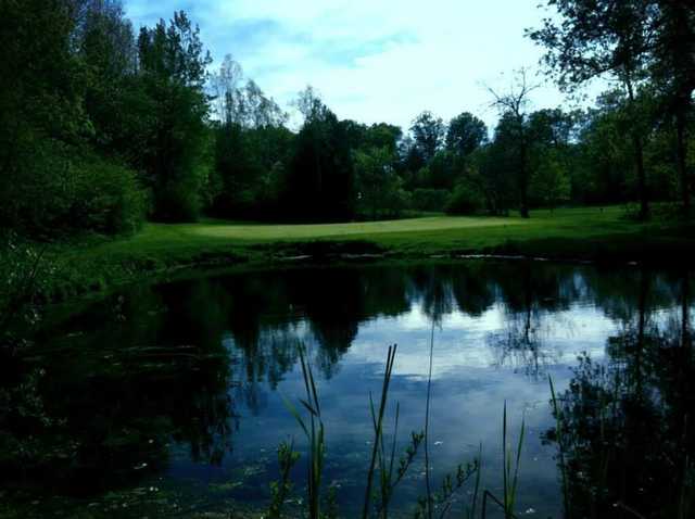 A view over the water of the 17th green at Valley from Remington Parkview Golf and Country Club