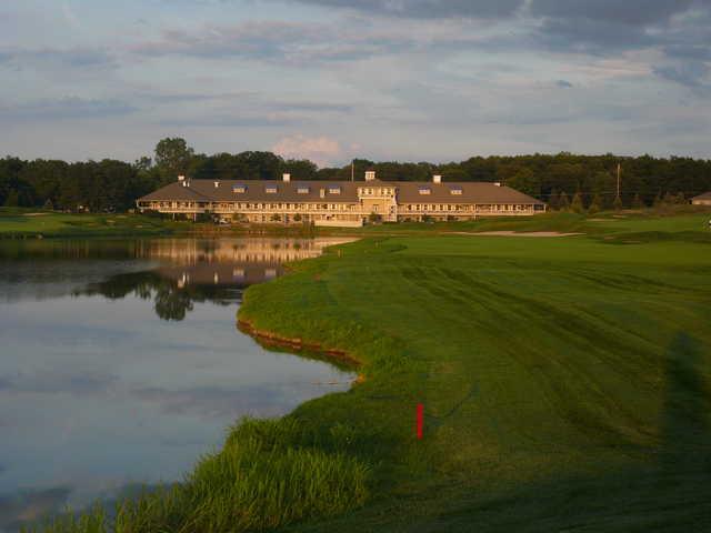 Eagle Eye Golf Club's giant clubhouse serves as the backdrop on No. 9