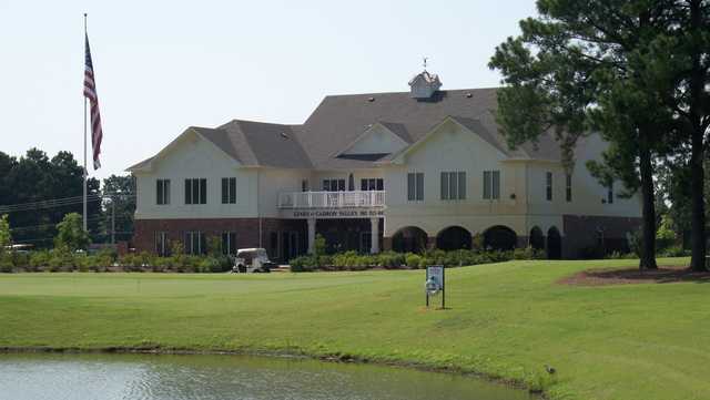 A view of the practice putting green and clubhouse from The Links at Cadron Valley Golf & Country Club