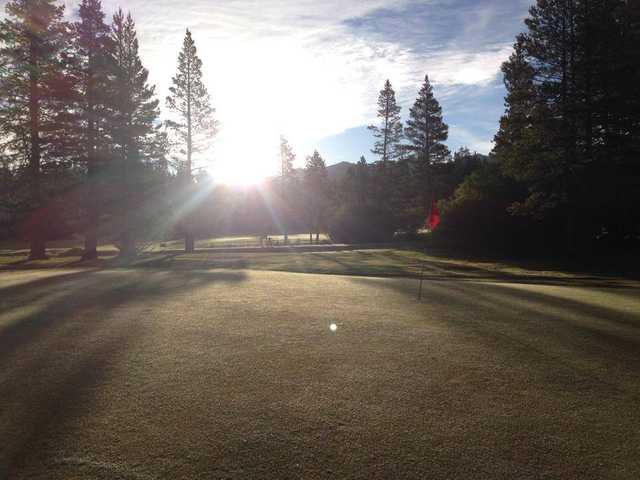 A sunny day view of a hole at Tahoe Paradise Golf Course