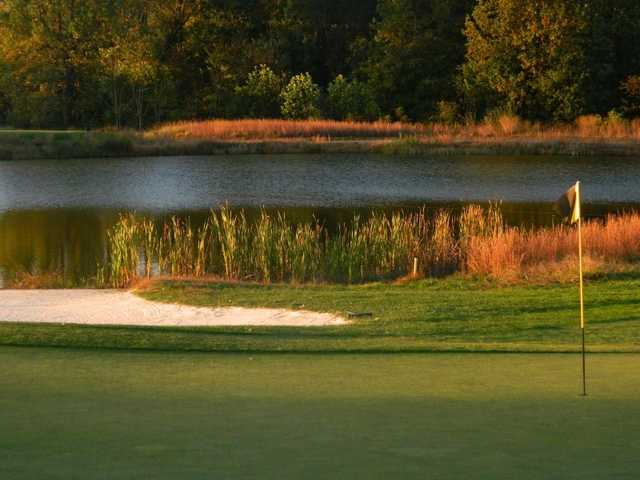 A view of a hole with water in background at Back Creek Golf Club