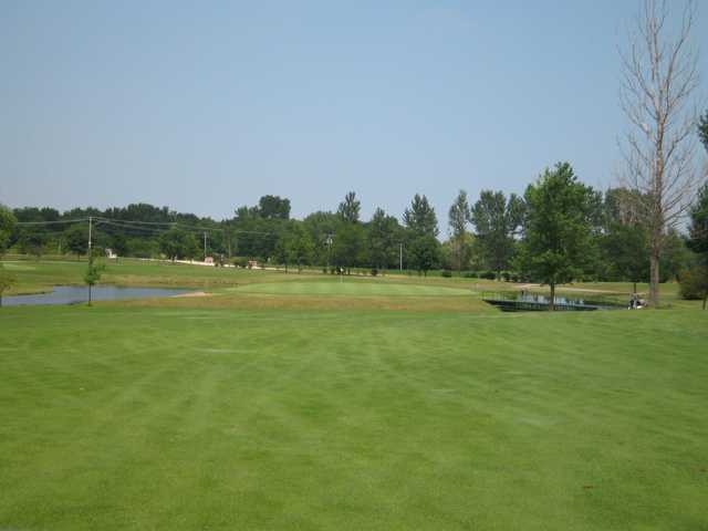 A view of a green surrounded by water at Gold Course from Green Garden Country Club