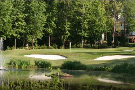 A view of a hole protected by tricky bunkers at Olde Sycamore Golf Plantation