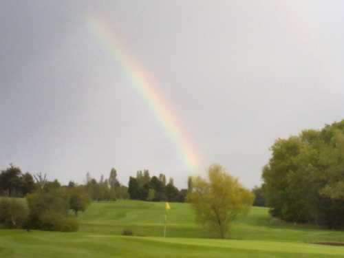 A view of a hole protected by a rainbow at Billingbear Park Golf Club