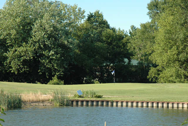 A view over the water of hole #10 at River Heights Golf Course
