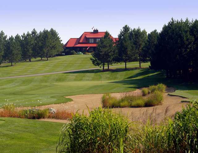 A view of a hole protected by a sand area at Diamond In The Ruff Golf Club