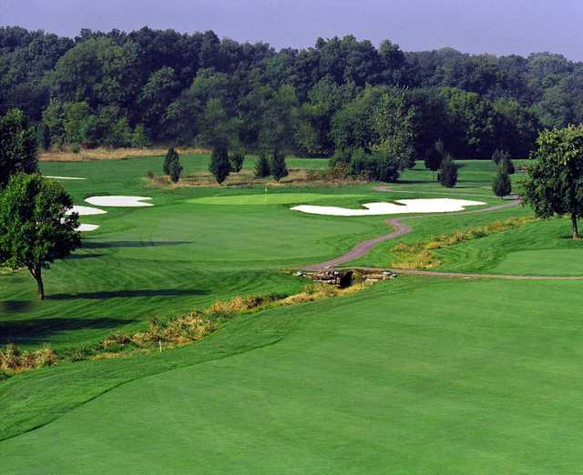 A view of a green surrounded by tricky bunkers at Royal Oaks Golf Club