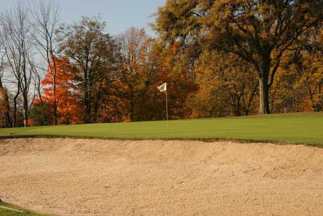 A view of a holeguarded by a bunker at Salem Hills Golf Club