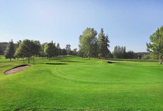 A view of a green protected by bunkers at Port Townsend Golf Club