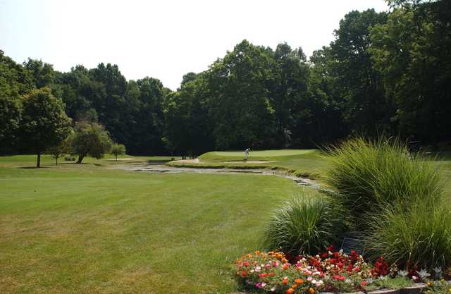 A view of a green surrounded by water from Meadowbrook at Clayton