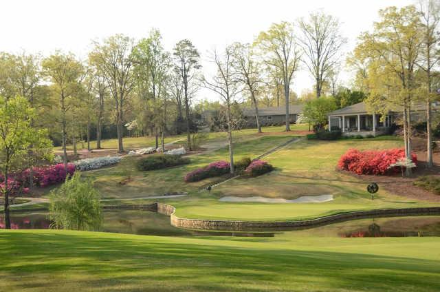 A view of a green surrounded by water at Chanticleer from Greenville Country Club