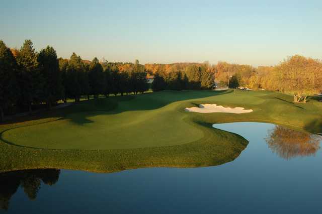 A view over the water of hole #18 at Shawneeki Golf Club