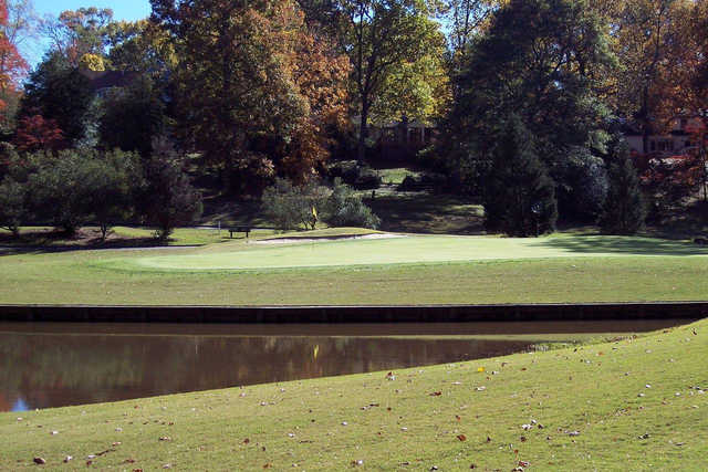 A view of a green with water coming into play at Brookwoods Golf Club