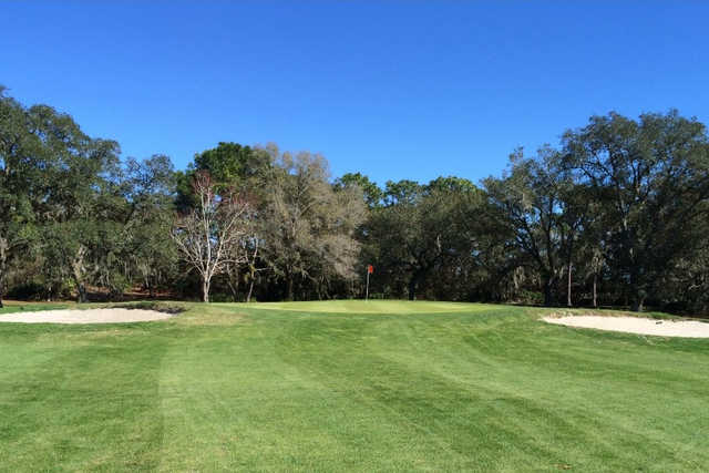 A view of the 1st green flanked by bunkers at Heather Golf & Country Club
