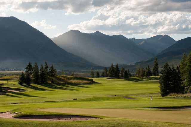A view of a green guarded by tricky bunkers at Crested Butte Country Club