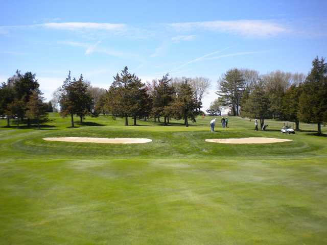 A view of a hole protected by bunkers on both sides at Blackstone Country Club