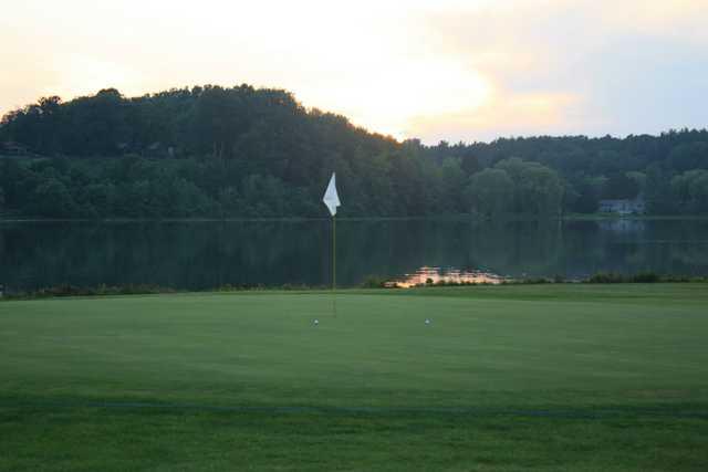 A view of a hole with water in background at Waters Edge Golf Club